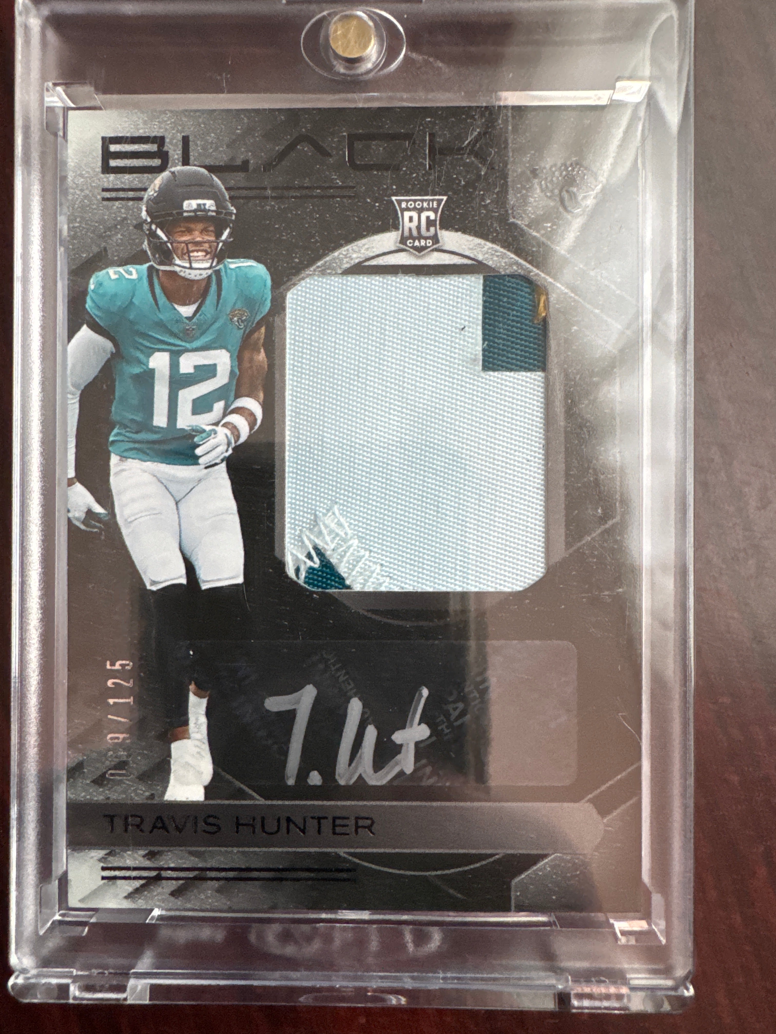 2025 Panini Black Travis Hunter RKPA-THR Rookie Patch Auto 69/125